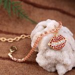 Load image into Gallery viewer, Rose Tone 'Lips" Clasp Bracelet